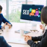 SEO specialists discussing in an SEO company